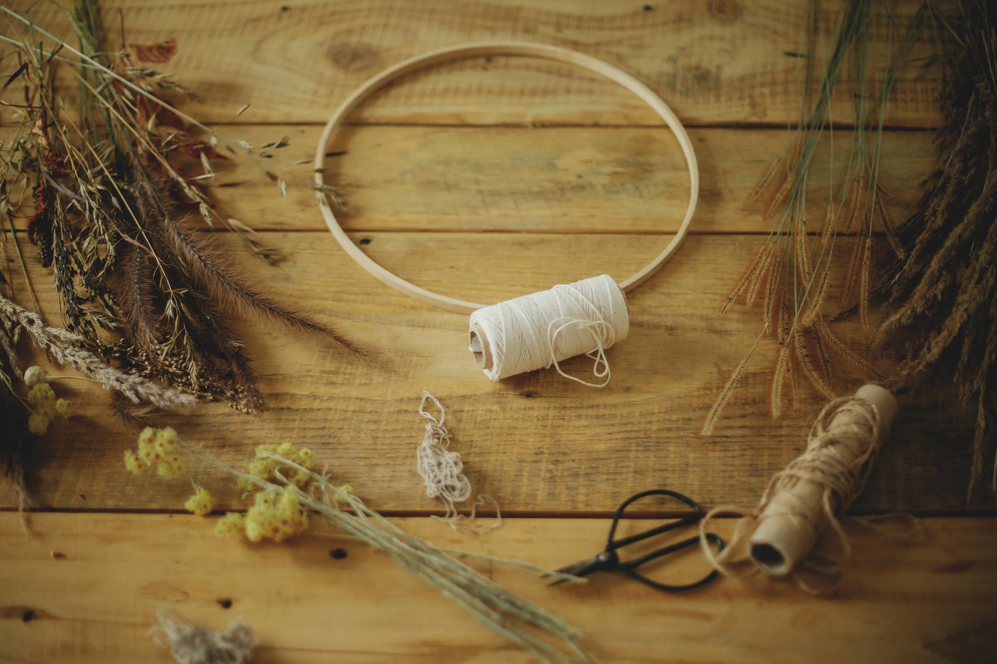 studio workspace with hoop and threads